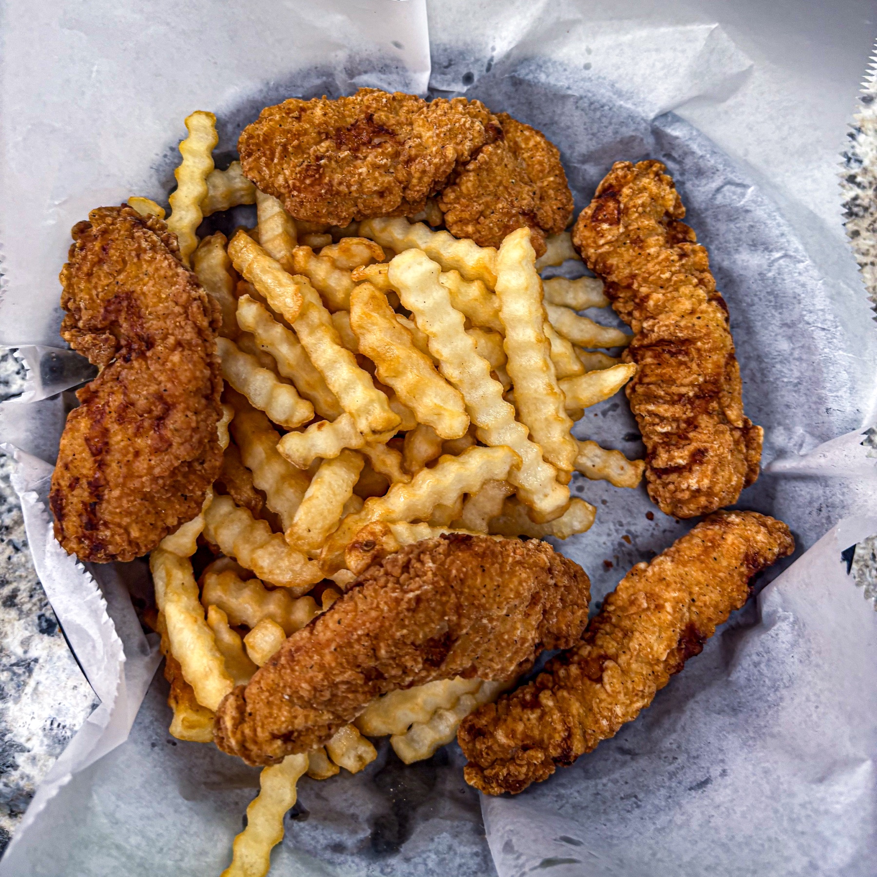 Chicken tenders basket with fries at Royal Biscuit